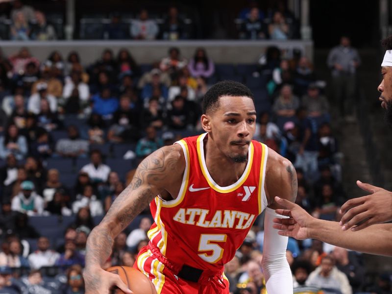 MEMPHIS, TN - MARCH 8: Dejounte Murray #5 of the Atlanta Hawks dribbles the ball during the game against the Memphis Grizzlies on March 8, 2024 at FedExForum in Memphis, Tennessee. NOTE TO USER: User expressly acknowledges and agrees that, by downloading and or using this photograph, User is consenting to the terms and conditions of the Getty Images License Agreement. Mandatory Copyright Notice: Copyright 2024 NBAE (Photo by Joe Murphy/NBAE via Getty Images)