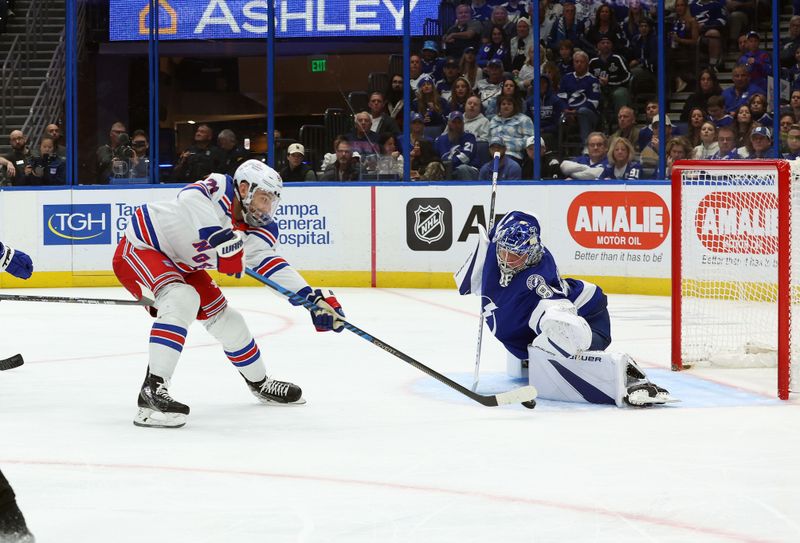 Dec 30, 2023; Tampa, Florida, USA; New York Rangers center Barclay Goodrow (21) shoots on goal as Tampa Bay Lightning goaltender Andrei Vasilevskiy (88) makes a save during the second period at Amalie Arena. Mandatory Credit: Kim Klement Neitzel-USA TODAY Sports