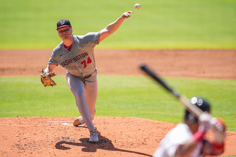 Aug 25, 2024; Cumberland, Georgia, USA; Washington Nationals starting pitcher DJ Herz (74) pitches against the Atlanta Braves during the first inning at Truist Park. Mandatory Credit: Dale Zanine-USA TODAY Sports