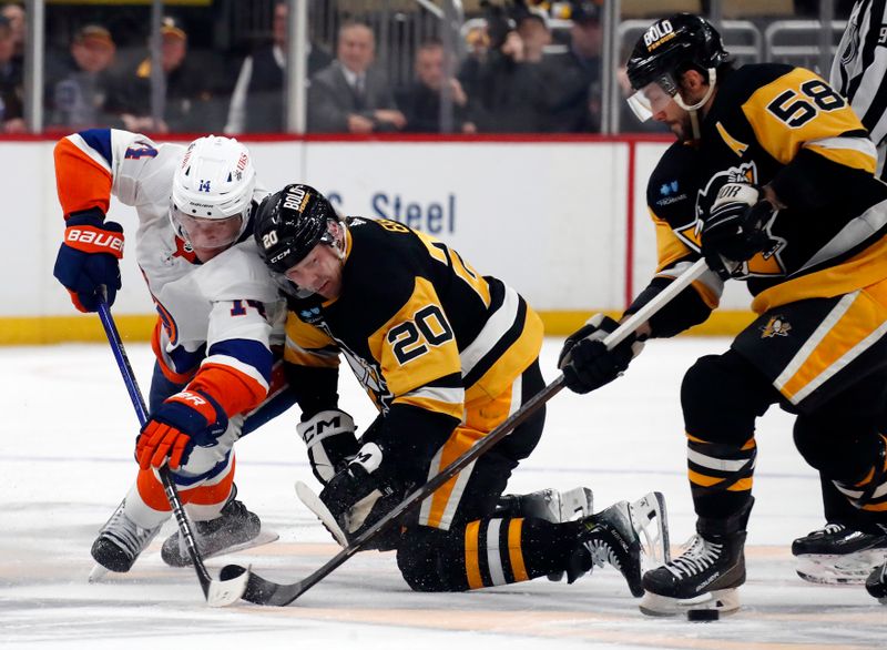 Feb 20, 2024; Pittsburgh, Pennsylvania, USA; New York Islanders center Bo Horvat (14) and Pittsburgh Penguins center Lars Eller (20) battle for the puck on an overtime face-off at PPG Paints Arena. New York won 5-4 in overtime.Mandatory Credit: Charles LeClaire-USA TODAY Sports