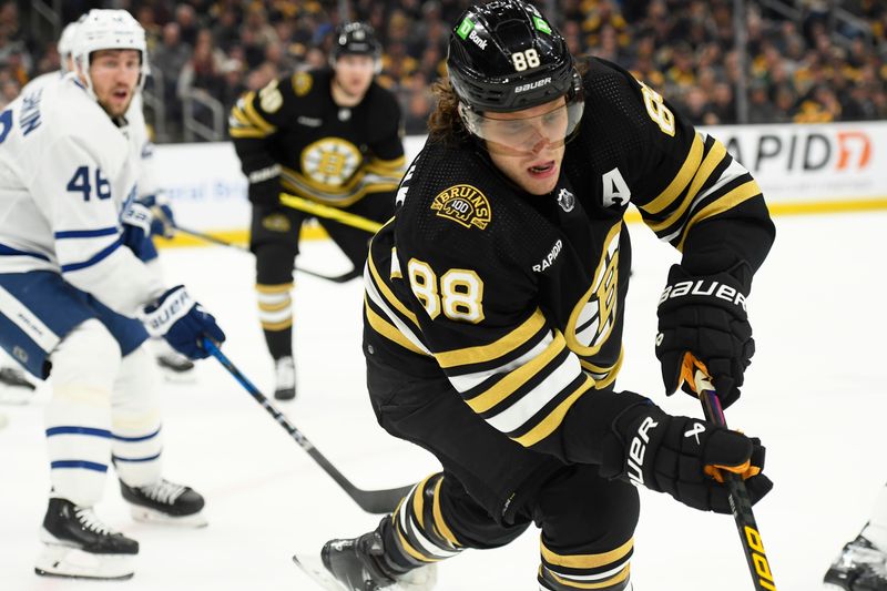 Apr 20, 2024; Boston, Massachusetts, USA; Boston Bruins right wing David Pastrnak (88) chases the puck in the corner during the first period in game one of the first round of the 2024 Stanley Cup Playoffs against the Toronto Maple Leafs at TD Garden. Mandatory Credit: Bob DeChiara-USA TODAY Sports