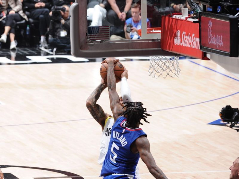 LOS ANGELES, CA - APRIL 12: Bones Hyland #5 of the LA Clippers blocks the shot during the game against the Utah Jazz on April 12, 2024 at Crypto.Com Arena in Los Angeles, California. NOTE TO USER: User expressly acknowledges and agrees that, by downloading and/or using this Photograph, user is consenting to the terms and conditions of the Getty Images License Agreement. Mandatory Copyright Notice: Copyright 2024 NBAE (Photo by Adam Pantozzi/NBAE via Getty Images)