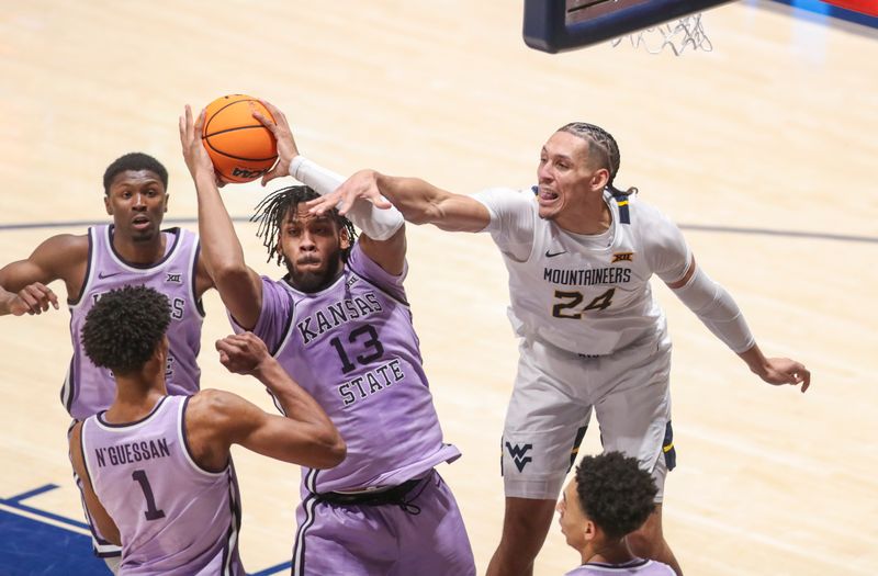 Jan 9, 2024; Morgantown, West Virginia, USA; Kansas State Wildcats forward Will McNair Jr. (13) grabs a rebound over West Virginia Mountaineers forward Patrick Suemnick (24) during the first half at WVU Coliseum. Mandatory Credit: Ben Queen-USA TODAY Sports