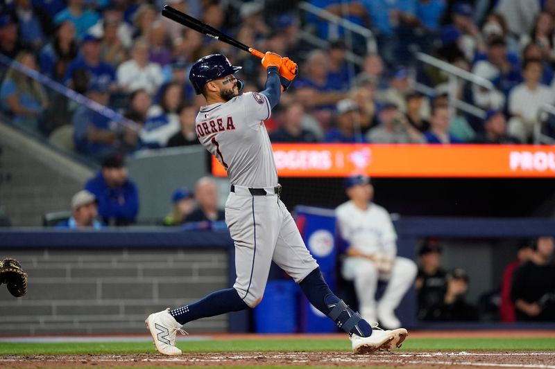 Sep 10, 2025; Toronto, Ontario, CAN; Houston Astros shortstop Carlos Correa (1) hits a solo home run against the Toronto Blue Jays during the sixth inning at Rogers Centre. Mandatory Credit: John E. Sokolowski-Imagn Images