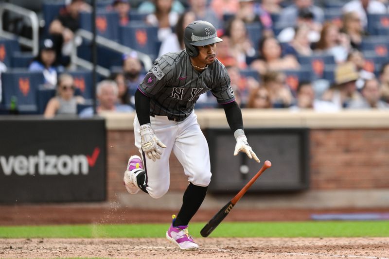 Jun 29, 2024; New York City, New York, USA; New York Mets shortstop Francisco Lindor (12) hits a single against the Houston Astros during the eighth inning at Citi Field. Mandatory Credit: John Jones-USA TODAY Sports