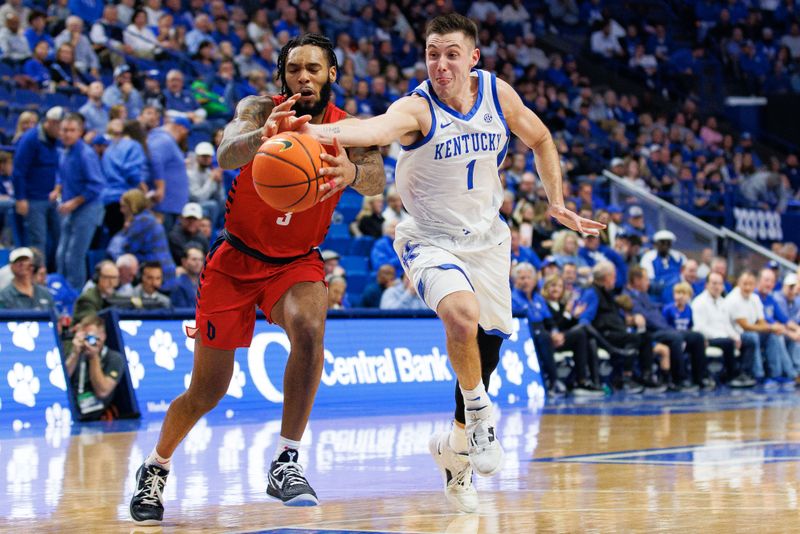 Nov 11, 2022; Lexington, Kentucky, USA; Kentucky Wildcats guard CJ Fredrick (1) attempts to steal the ball from Duquesne Dukes guard Dae Dae Grant (3) during the second half at Rupp Arena at Central Bank Center. Mandatory Credit: Jordan Prather-USA TODAY Sports