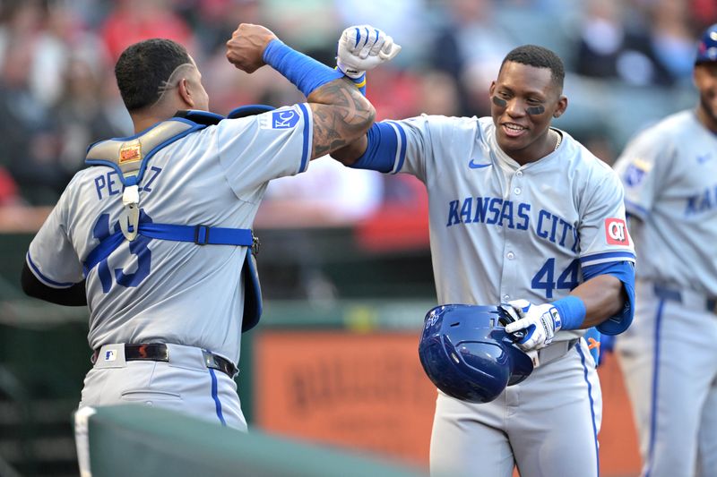 May 9, 2024; Anaheim, California, USA;  Kansas City Royals outfielder Dairon Blanco (44) is congratulated by third base coach Vance Wilson (25) after hitting a two-run home run off Los Angeles Angels pitcher Reid Detmers (48) in the third inning at Angel Stadium. Mandatory Credit: Jayne Kamin-Oncea-USA TODAY Sports