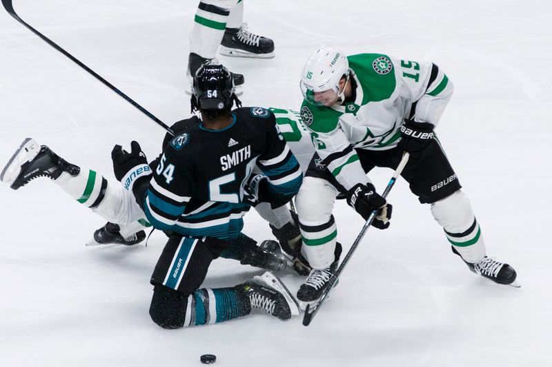 Mar 5, 2024; San Jose, California, USA; San Jose Sharks right wing Givani Smith (54) and Dallas Stars center Craig Smith (15) collide during the third period at SAP Center at San Jose. Mandatory Credit: John Hefti-USA TODAY Sports