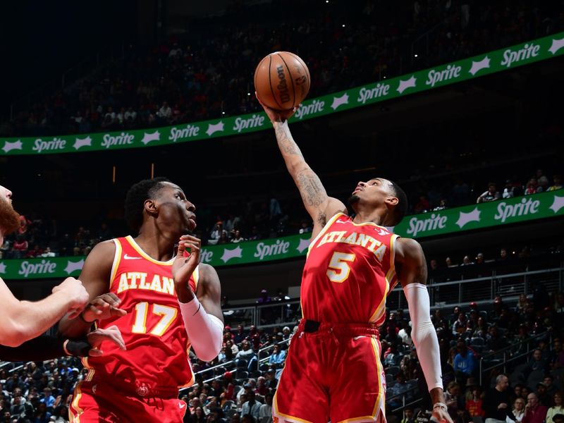 ATLANTA, GA - FEBRUARY 2: Dejounte Murray #5 of the Atlanta Hawks grabs a rebound during the game against the Phoenix Suns on February 2, 2024 at State Farm Arena in Atlanta, Georgia.  NOTE TO USER: User expressly acknowledges and agrees that, by downloading and/or using this Photograph, user is consenting to the terms and conditions of the Getty Images License Agreement. Mandatory Copyright Notice: Copyright 2024 NBAE (Photo by Scott Cunningham/NBAE via Getty Images)