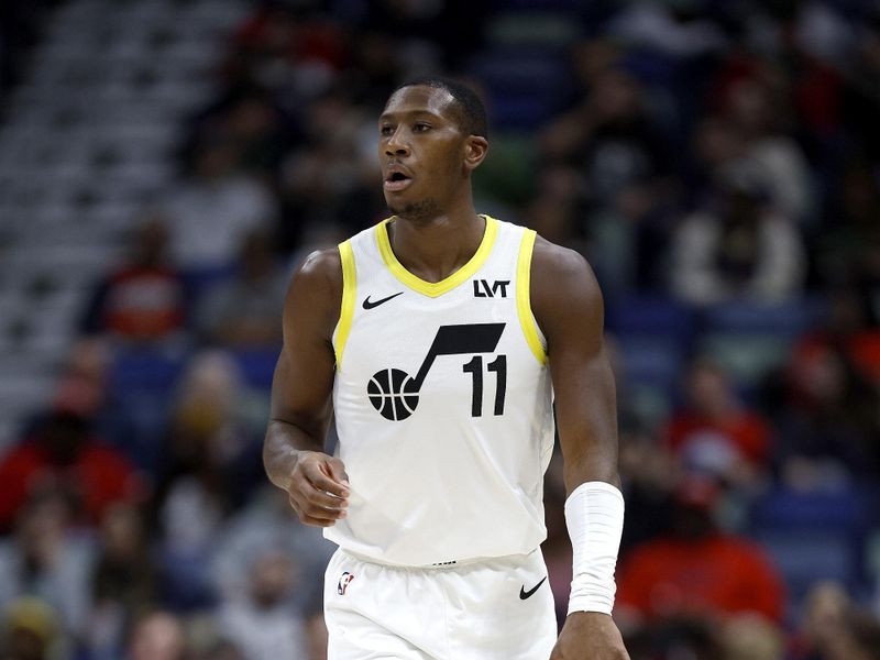 NEW ORLEANS, LOUISIANA - JANUARY 23: Kris Dunn #11 of the Utah Jazz dribbles the ball down court during the first quarter of an NBA game against the New Orleans Pelicans at Smoothie King Center on January 23, 2024 in New Orleans, Louisiana. NOTE TO USER: User expressly acknowledges and agrees that, by downloading and or using this photograph, User is consenting to the terms and conditions of the Getty Images License Agreement. (Photo by Sean Gardner/Getty Images)