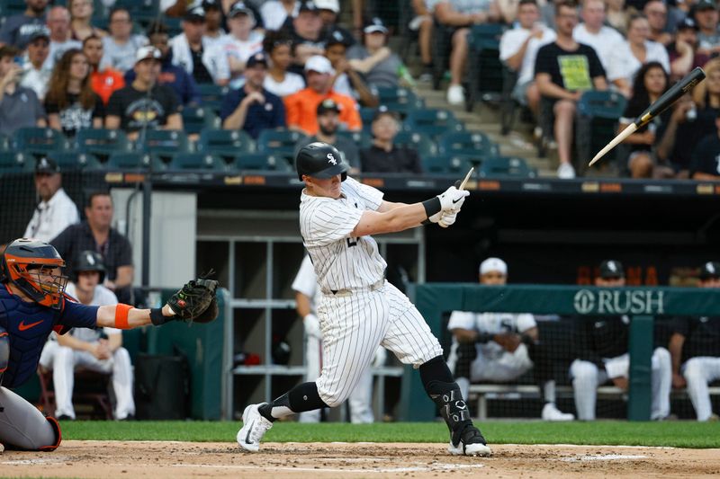 Jun 18, 2024; Chicago, Illinois, USA; Chicago White Sox first baseman Andrew Vaughn (25) breaks his bat as he grounds into force out against the Houston Astros during the third inning at Guaranteed Rate Field. Mandatory Credit: Kamil Krzaczynski-USA TODAY Sports