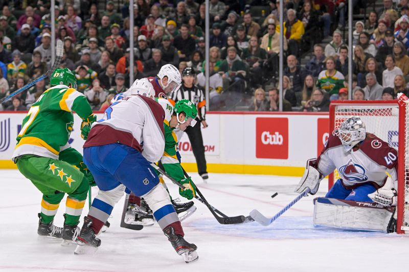 Nov 24, 2023; Saint Paul, Minnesota, USA; Minnesota Wild forward Joel Eriksson Ek (14) beats Colorado Avalanche goalie Alexandar Georgiev (40) for a power play goal during the second period at Xcel Energy Center. Mandatory Credit: Nick Wosika-USA TODAY Sports