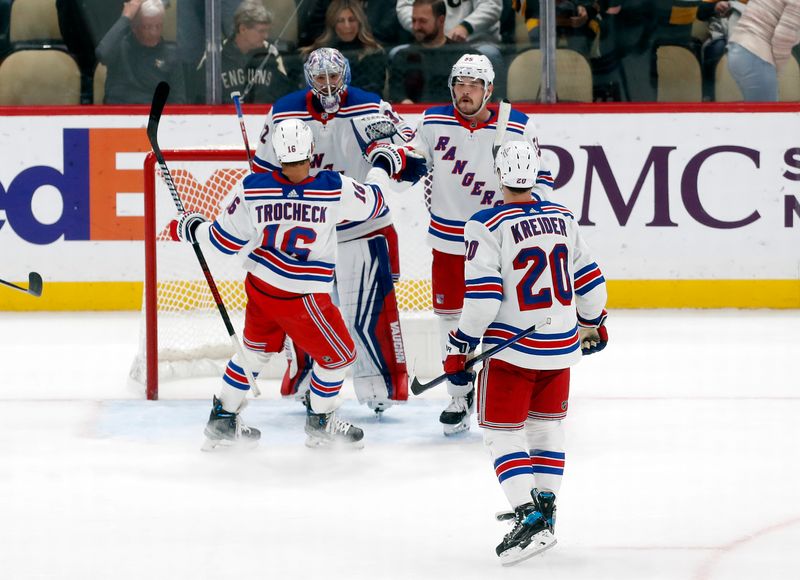 Nov 22, 2023; Pittsburgh, Pennsylvania, USA; New York Rangers center Vincent Trocheck (16) and goaltender Jonathan Quick (32) and left wing Chris Kreider (20) and defenseman Ryan Lindgren (55) celebrate after defeating the Pittsburgh Penguins at PPG Paints Arena. The Rangers won 1-0. Mandatory Credit: Charles LeClaire-USA TODAY Sports/