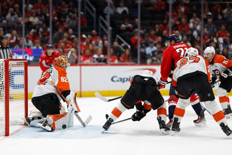 Oct 23, 2024; Washington, District of Columbia, USA; Philadelphia Flyers goaltender Ivan Fedotov (82) makes a save on Washington Capitals center Aliaksei Protas (21) in the third period at Capital One Arena. Mandatory Credit: Geoff Burke-Imagn Images