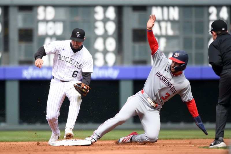 Apr 19, 2025; Denver, Colorado, USA; Washington Nationals outfielder Dylan Crews (3) slides safely into second ahead of a play by Colorado Rockies second base Kyle Farmer (6) during the fourth inning at Coors Field. Mandatory Credit: Christopher Hanewinckel-Imagn Images