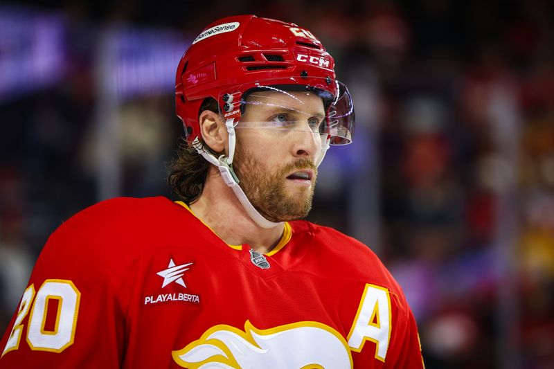 Nov 15, 2024; Calgary, Alberta, CAN; Calgary Flames center Blake Coleman (20) against the Nashville Predators during the third period at Scotiabank Saddledome. Mandatory Credit: Sergei Belski-Imagn Images