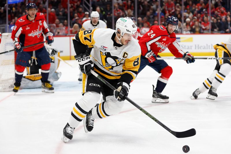 Apr 4, 2024; Washington, District of Columbia, USA; Pittsburgh Penguins center Sidney Crosby (87) skates with the puck as Washington Capitals center Connor McMichael (24) chases in the first period at Capital One Arena. Mandatory Credit: Geoff Burke-USA TODAY Sports