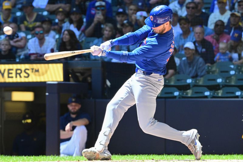 Jun 30, 2024; Milwaukee, Wisconsin, USA; Chicago Cubs designated hitter Cody Bellinger (24) hits a single against the Milwaukee Brewers in the first inning at American Family Field. Mandatory Credit: Benny Sieu-USA TODAY Sports