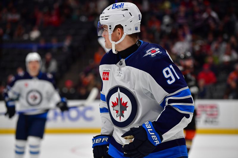 Jan 5, 2024; Anaheim, California, USA; Winnipeg Jets center Cole Perfetti (91) reacts after scoring a goal against the Anaheim Ducks during the third period at Honda Center. Mandatory Credit: Gary A. Vasquez-USA TODAY Sports