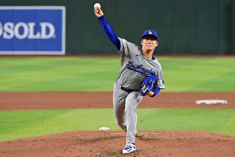 May 1, 2024; Phoenix, Arizona, USA;  Los Angeles Dodgers pitcher Yoshinobu Yamamoto (18) throws in the third inning against the Arizona Diamondbacks at Chase Field. Mandatory Credit: Matt Kartozian-USA TODAY Sports