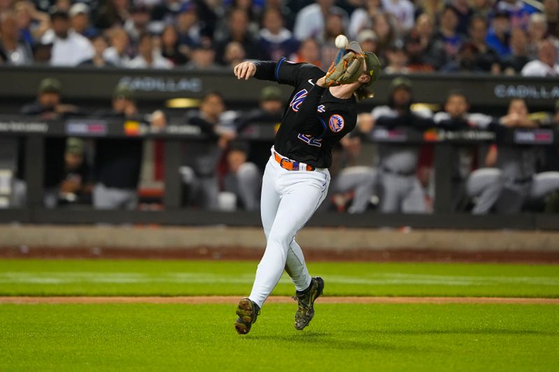 May 21, 2023; New York City, New York, USA; New York Mets third baseman Brett Baty (22) catches a fly ball hit by Cleveland Guardians left fielder Steven Kwan (38) (not pictured) during the sixth inning at Citi Field. Mandatory Credit: Gregory Fisher-USA TODAY Sports