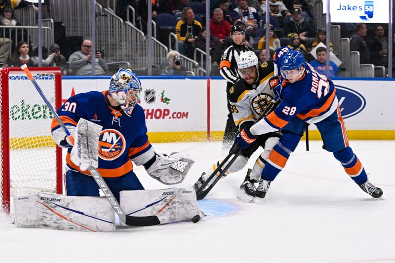 Nov 27, 2024; Elmont, New York, USA;  New York Islanders goaltender Ilya Sorokin (30) makes a save against the Boston Bruins during the first period at UBS Arena. Mandatory Credit: Dennis Schneidler-Imagn Images