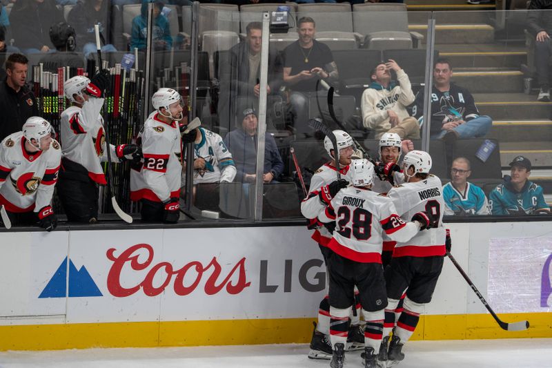 Nov 27, 2024; San Jose, California, USA; Ottawa Senators center Josh Norris (9) and Ottawa Senators center Tim Stützle (18) and teammates celebrate after the goal against the San Jose Sharks during the second period at SAP Center at San Jose. Mandatory Credit: Neville E. Guard-Imagn Images