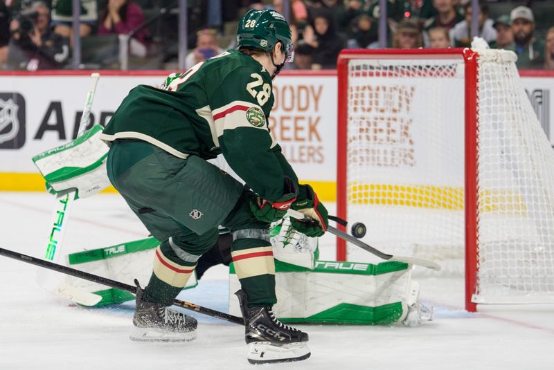 Sep 25, 2025; Saint Paul, Minnesota, USA; Minnesota Wild left wing Liam Ohgren (28) sets up a backhand shot against Dallas Stars goaltender Casey DeSmith (1) in the third period at Grand Casino Arena. Mandatory Credit: Matt Blewett-Imagn Images