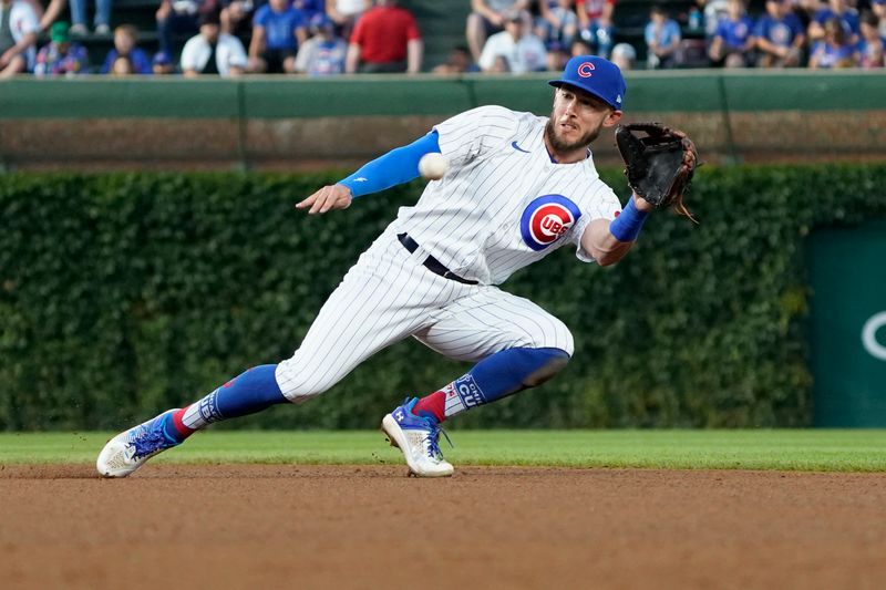 Jul 18, 2023; Chicago, Illinois, USA; Chicago Cubs second baseman Miles Mastrobuoni (20) starts a double play on Washington Nationals left fielder Corey Dickerson (not pictured) during the fourth inning at Wrigley Field. Mandatory Credit: David Banks-USA TODAY Sports