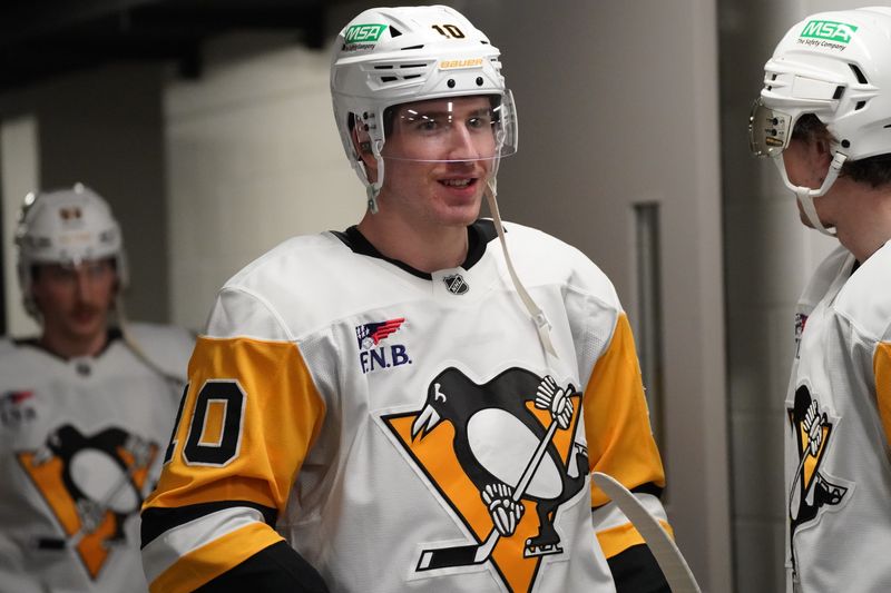 Jan 27, 2025; San Jose, California, USA;  Pittsburgh Penguins left winger Drew O'Connor (10) during pre-game warms up against the San Jose Sharks at SAP Center at San Jose. Mandatory Credit: David Gonzales-Imagn Images