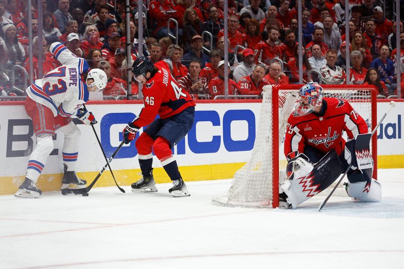 Apr 26, 2024; Washington, District of Columbia, USA; New York Rangers center Matt Rempe (73) and Washington Capitals defenseman Lucas Johansen (46) battle for the puck behind Capitals goaltender Charlie Lindgren (79) in the second period in game three of the first round of the 2024 Stanley Cup Playoffs at Capital One Arena. Mandatory Credit: Geoff Burke-USA TODAY Sports