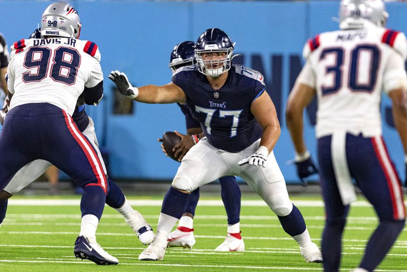 Tennessee Titans offensive tackle Peter Skoronski (77) blocks during their NFL football game against the New England Patriots Friday, Aug. 25, 2023, in Nashville, Tenn. (AP Photo/Wade Payne)