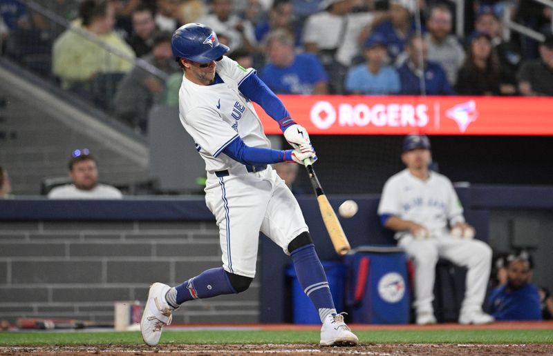 Aug 22, 2024; Toronto, Ontario, CAN; Toronto Blue Jays third baseman Ernie Clement (28) bats against the Los Angeles Angels in the sixth inning at Rogers Centre. Mandatory Credit: Dan Hamilton-USA TODAY Sports