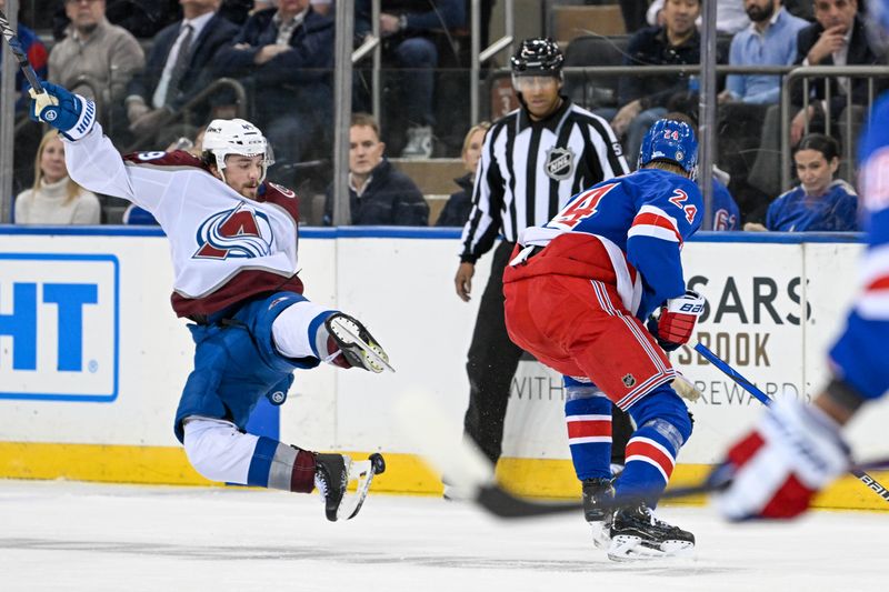 Feb 5, 2024; New York, New York, USA;  Colorado Avalanche defenseman Samuel Girard (49) falls to the ice against the New York Rangers during the second period at Madison Square Garden. Mandatory Credit: Dennis Schneidler-USA TODAY Sports