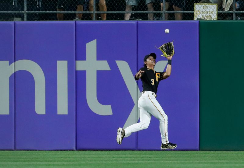 Aug 24, 2023; Pittsburgh, Pennsylvania, USA;  Pittsburgh Pirates second baseman Ji Hwan Bae (3) makes a catch for an out against Chicago Cubs center fielder Cody Bellinger (not pictured) during the sixth inning at PNC Park. Mandatory Credit: Charles LeClaire-USA TODAY Sports