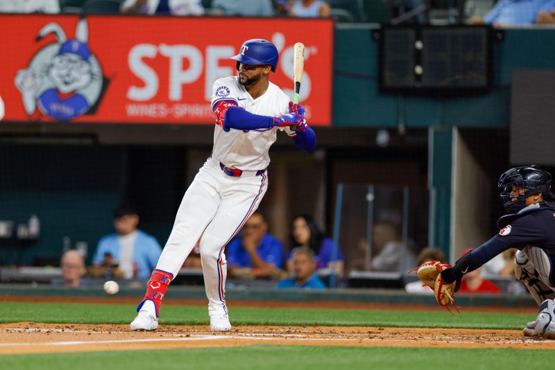 May 13, 2024; Arlington, Texas, USA; Texas Rangers outfielder Leody Taveras (3) jumps to avoid being hit by a pitch during the third inning against the Cleveland Guardians at Globe Life Field. Mandatory Credit: Andrew Dieb-USA TODAY Sports