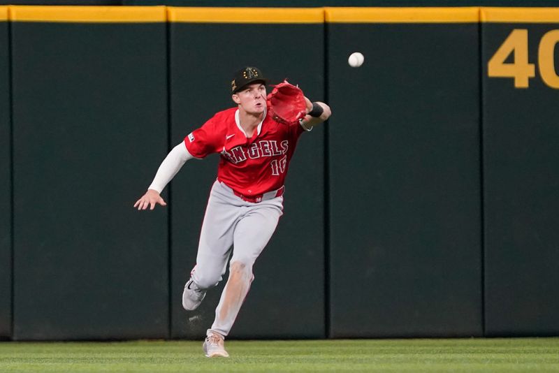 May 18, 2024; Arlington, Texas, USA; Los Angeles Angels right fielder Mickey Moniak (16) makes the catch during the eighth inning against the Texas Rangers at Globe Life Field. Mandatory Credit: Raymond Carlin III-USA TODAY Sports