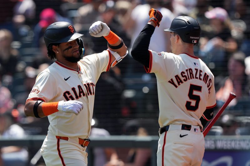 May 3, 2025; San Francisco, California, USA; San Francisco Giants designated hitter Luis Matos (left) celebrates with right fielder Mike Yastrzemski (5) after hitting a home run against the Colorado Rockies during the third inning at Oracle Park. Mandatory Credit: Darren Yamashita-Imagn Images