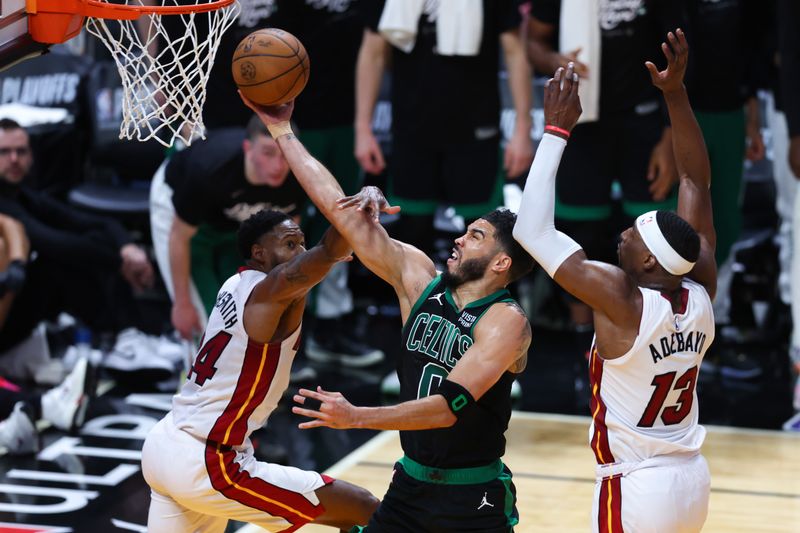 MIAMI, FLORIDA - APRIL 27: Jayson Tatum #0 of the Boston Celtics drives to the basket against Haywood Highsmith #24 of the Miami Heat during the second quarter in game three of the Eastern Conference First Round Playoffs at Kaseya Center on April 27, 2024 in Miami, Florida.  NOTE TO USER: User expressly acknowledges and agrees that, by downloading and or using this photograph, User is consenting to the terms and conditions of the Getty Images License Agreement. (Photo by Megan Briggs/Getty Images)