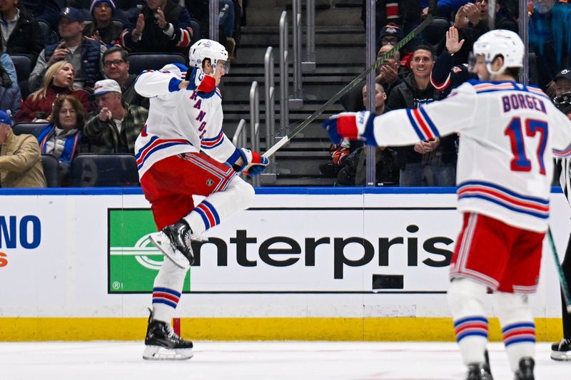 Feb 25, 2025; Elmont, New York, USA;  New York Rangers center Matt Rempe (73) celebrates his goal against the New York Islanders during the second period at UBS Arena. Mandatory Credit: Dennis Schneidler-Imagn Images