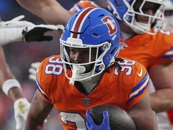 Denver Broncos running back Jaleel McLaughlin (38) runs the ball against the Kansas City Chiefs during an NFL football game, Sunday, Jan. 5, 2025 in Denver. (AP Photo/Bart Young)