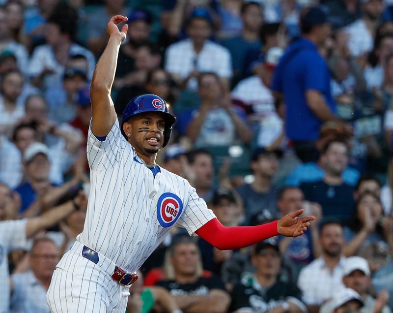 Jun 5, 2024; Chicago, Illinois, USA; Chicago Cubs third baseman Christopher Morel (5) reacts after scoring against the Chicago White Sox  during the second inning at Wrigley Field. Mandatory Credit: Kamil Krzaczynski-USA TODAY Sports