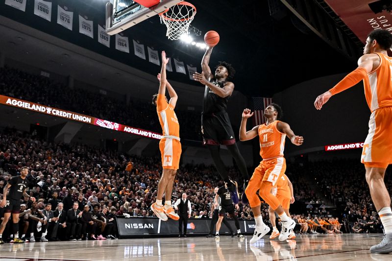 Feb 21, 2023; College Station, Texas, USA;  Texas A&M Aggies forward Julius Marble (34) drives to the basket against Tennessee Volunteers guard Santiago Vescovi (25) during the second half at Reed Arena. Mandatory Credit: Maria Lysaker-USA TODAY Sports