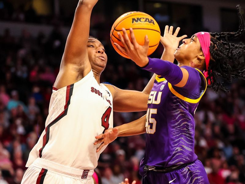 Feb 12, 2023; Columbia, South Carolina, USA; South Carolina Gamecocks forward Aliyah Boston (4) blocks the shot of LSU Lady Tigers guard Alexis Morris (45) in the second half at Colonial Life Arena. Mandatory Credit: Jeff Blake-USA TODAY Sports