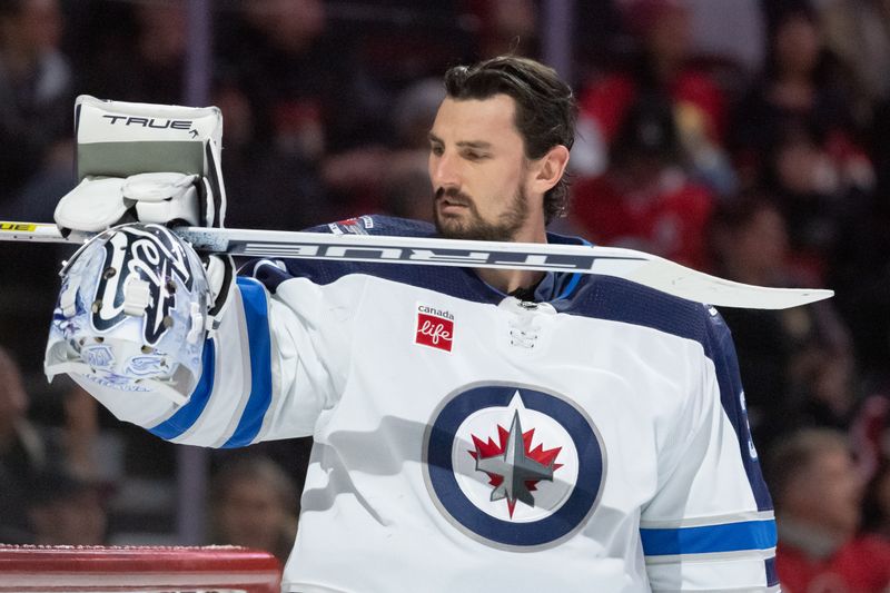 Jan 20, 2024; Ottawa, Ontario, CAN; Winnipeg Jets goalie Connor Hellebuyck (37) prior to the start of game against the Ottawa Senators at the Canadian Tire Centre. Mandatory Credit: Marc DesRosiers-USA TODAY Sports