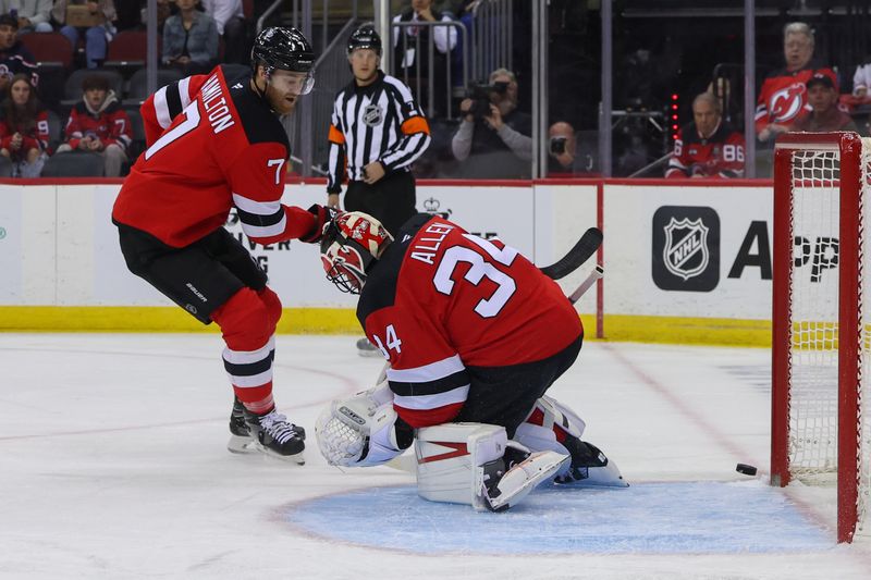 Oct 25, 2024; Newark, New Jersey, USA; New Jersey Devils goaltender Jake Allen (34) makes a save on New York Islanders center Bo Horvat (14) (not shown) during the first period at Prudential Center. Mandatory Credit: Ed Mulholland-Imagn Images