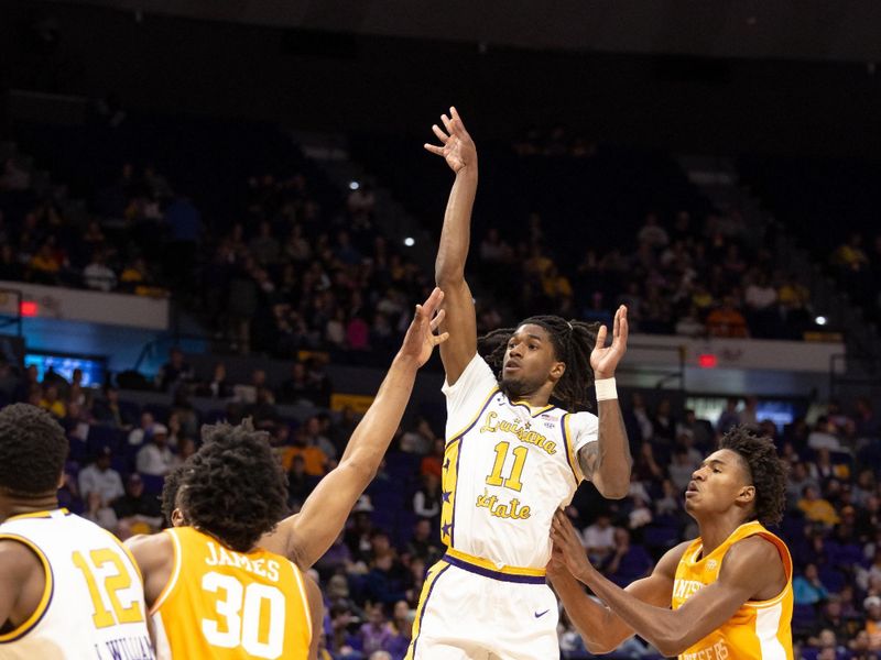 Jan 21, 2023; Baton Rouge, Louisiana, USA;  LSU Tigers guard Justice Williams (11) shoots a jump shot against Tennessee Volunteers guard Josiah-Jordan James (30) during the first half at Pete Maravich Assembly Center. Mandatory Credit: Stephen Lew-USA TODAY Sports