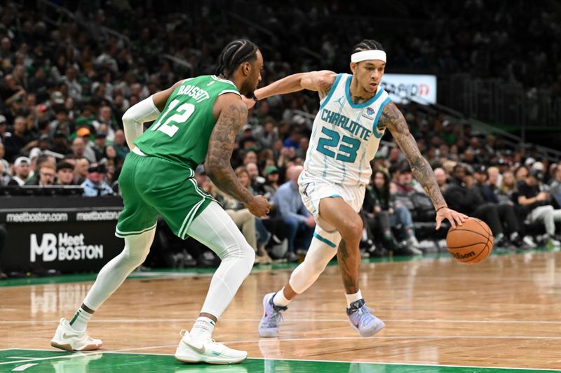 BOSTON, MASSACHUSETTS - APRIL 12: Tre Mann #23 of the Charlotte Hornets drives to the basket against Oshae Brissett #12 of the Boston Celtics during the third quarter at the TD Garden on April 12, 2024 in Boston, Massachusetts. NOTE TO USER: User expressly acknowledges and agrees that, by downloading and or using this photograph, User is consenting to the terms and conditions of the Getty Images License Agreement. (Photo by Brian Fluharty/Getty Images)