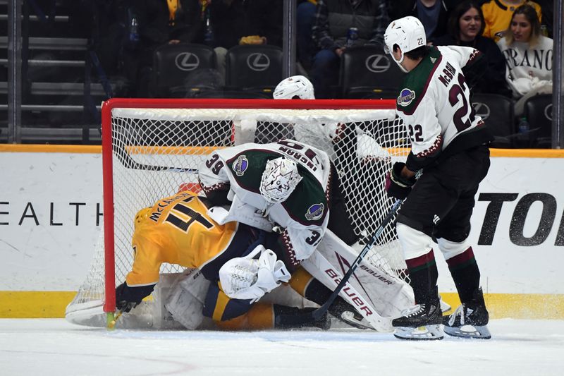 Feb 10, 2024; Nashville, Tennessee, USA; Nashville Predators right wing Michael McCarron (47) draws a penalty as he is hit into Arizona Coyotes goaltender Connor Ingram (39) by center Jack McBain (22) during the second period at Bridgestone Arena. Mandatory Credit: Christopher Hanewinckel-USA TODAY Sports