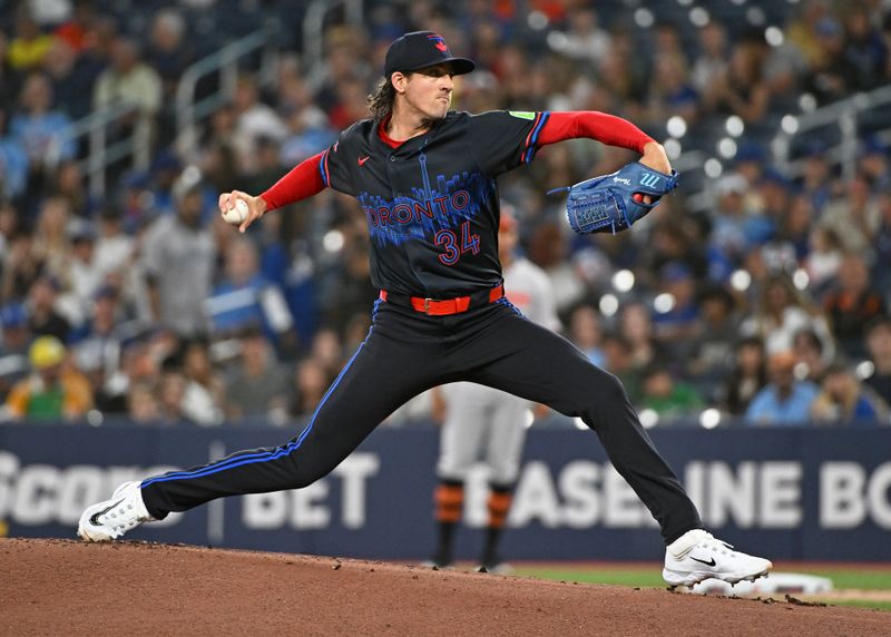 Aug 8, 2024; Toronto, Ontario, CAN; Toronto Blue Jays pitcher Kevin Gausman (34) pitches in the first inning against the Baltimore Orioles at Rogers Centre. Mandatory Credit: Gerry Angus-USA TODAY Sports